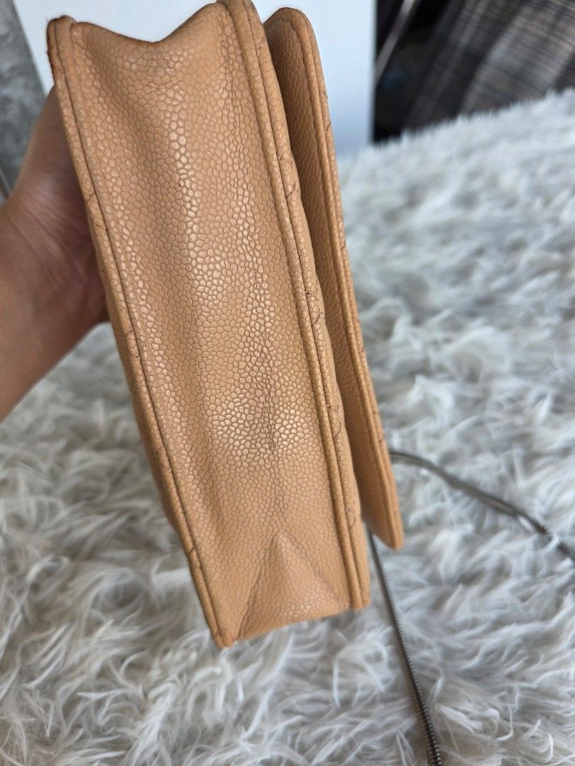 Chanel Quilted Caviar Leather Wallet (Category: Luxury Bags & Wallets) located in Lemery. Submitted by venus23 (Listing ID 1455320126, Image 3). Description: - Classic Chanel wallet in beige caviar leather - Features iconic diamond quilting and CC logo hardware - Multiple card slots and zippered compartments - Timeless piece for your essentials - Shows some signs of wear on edges and corners, consistent with regular use.