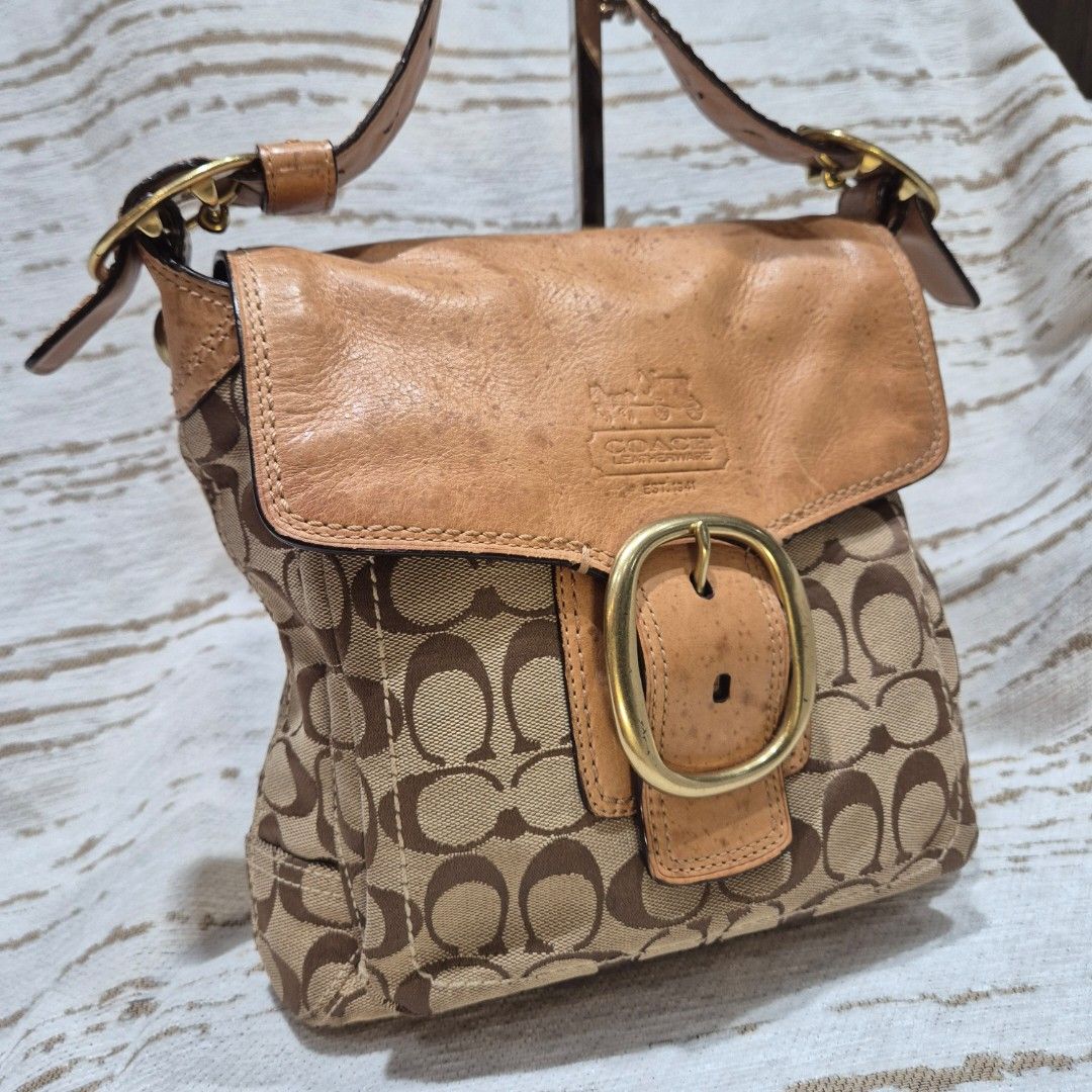 Coach Monogram Bleecker Leather Trim Shoulder Bag (Category: Luxury Bags & Wallets) located in Quezon City. Submitted by prelovedluxury21 (Listing ID 1455186628, Image 1). Description: - Authentic Coach shoulder bag - Classic monogram canvas with tan leather trim - Features a large buckle detail on the flap - Adjustable leather strap - Gold hardware - Ideal for everyday use.