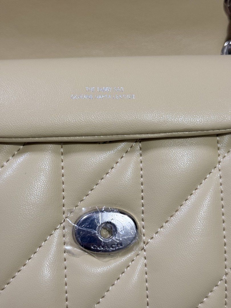 Coach Pillow Tabby Shoulder Yellow (Category: Luxury Bags & Wallets) located in Pasig City. Submitted by dindin25 (Listing ID 1455166875, Image 3). Description: - Yello Coach Pillow Tabby bag - Quilted leather with silver C logo closure - Chain strap - Interior zip pocket - Comes with dust bag and authenticity care Used twice for weddings size 26.