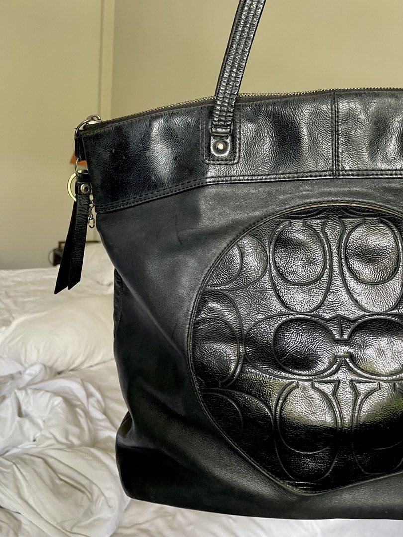 Coach Signature Embossed Leather Zip Tote (Category: Luxury Bags & Wallets) located in Manila. Submitted by swiftstone.f6e999 (Listing ID 1455164047, Image 3). Description: Authentic Coach Signature Embossed Leather Tote (Style F19826) Classic black Coach leather tote featuring the embossed Signature “C” design on the front. Spacious enough for everyday use, work, or travel, with a secure top zip closure and comfortable shoulder straps. Details: 