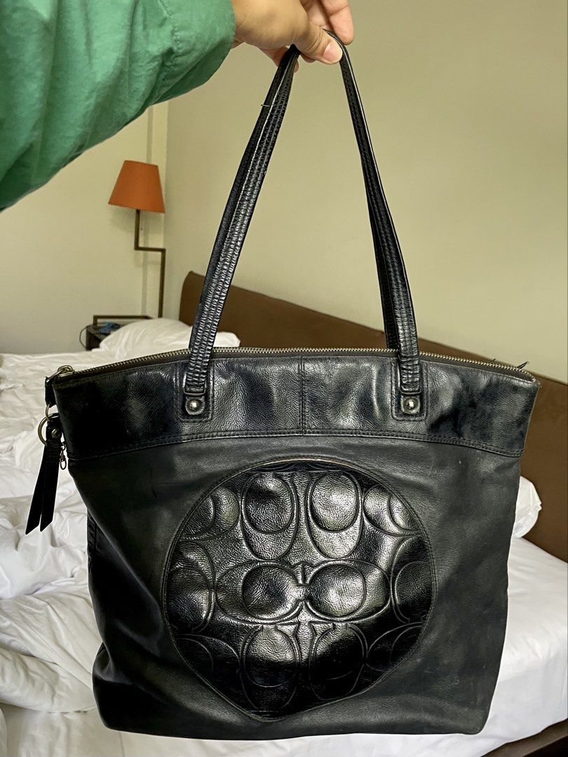 Coach Signature Embossed Leather Zip Tote (Category: Luxury Bags & Wallets) located in Manila. Submitted by swiftstone.f6e999 (Listing ID 1455164047, Image 1). Description: Authentic Coach Signature Embossed Leather Tote (Style F19826) Classic black Coach leather tote featuring the embossed Signature “C” design on the front. Spacious enough for everyday use, work, or travel, with a secure top zip closure and comfortable shoulder straps. Details: 