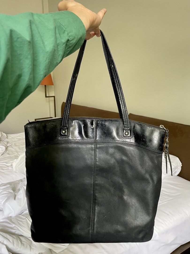 Coach Signature Embossed Leather Zip Tote (Category: Luxury Bags & Wallets) located in Manila. Submitted by swiftstone.f6e999 (Listing ID 1455164047, Image 2). Description: Authentic Coach Signature Embossed Leather Tote (Style F19826) Classic black Coach leather tote featuring the embossed Signature “C” design on the front. Spacious enough for everyday use, work, or travel, with a secure top zip closure and comfortable shoulder straps. Details: 