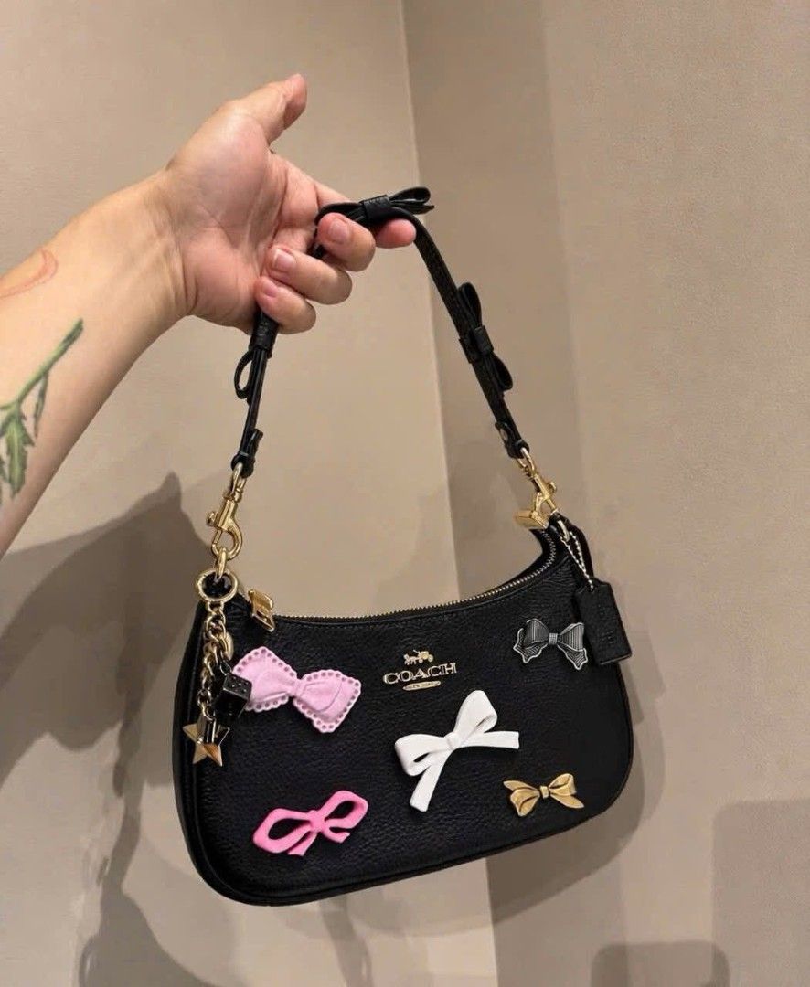 Coach Teri Shoulder Bag with Patches (Category: Shoulder Bags) located in Quezon City. Submitted by bagsboutiqueph (Listing ID 1455206657, Image 3). Description: LAST PRICE POSTED. LIMITED STOCKS! BRANDNEW WITH INCLUSIONS. COLOR MAY SLIGHTLY VARY IN ACTUAL DUE TO LIGHTING AND CAMERA SETTING. OTHER PHOTOS WILL BE SEND DURING PURCHASE AND FOR SURE BUYERS ONLY. WHEN IN DOUBT, DO NOT ORDER. THANK YOU..