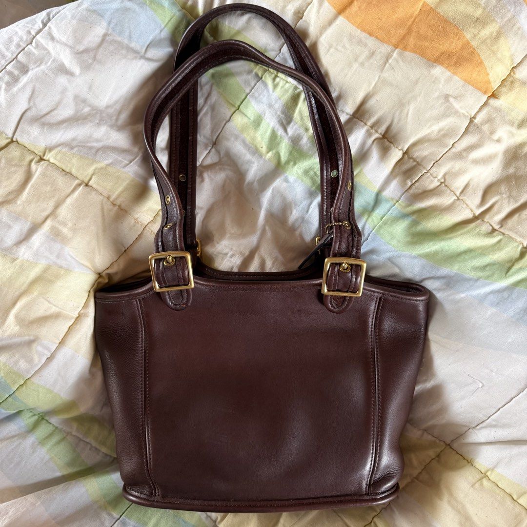 Coach Vintage Shoppers Tote Brown (Category: Luxury Bags & Wallets) located in Manila. Submitted by shoppolaflora (Listing ID 1455163533, Image 2). Description: - Creed E7D 9086 - Vintage Coach dark brown leather shoulder bag - Made in the USA - Zip-top closure - 2 interior pockets - Brass hardware - With original hang tag - Great condition, no major flaws. Just minor scratches and discoloration due to vintage nature Taken care of using Collonil 