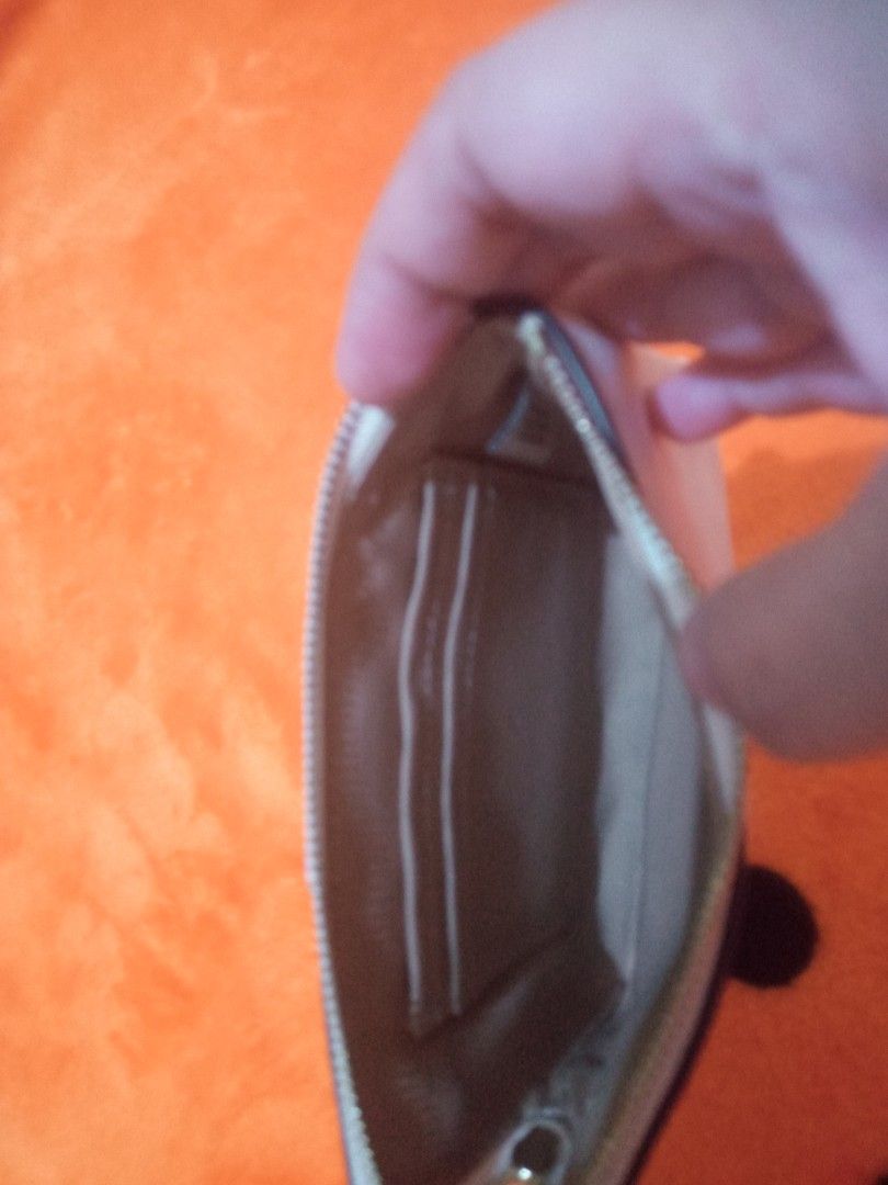 Coach wristlet (Category: Luxury Bags & Wallets) located in Caloocan City. Submitted by tweetyferrer (Listing ID 1455221040, Image 3). Description: still in excellent condition no flaws.