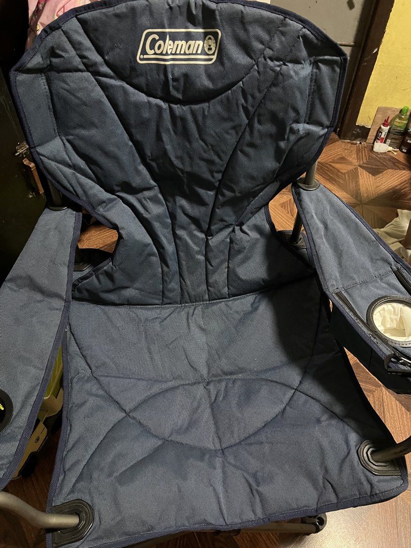 Coleman Camping Chair with Cup Holder (Category: Hiking & Camping) located in Quezon City. Submitted by daday39 (Listing ID 1455264267, Image 1). Description: - King Size -Navy blue Coleman camping chair - Built-in cup holder on armrest - Folds easily for storage and transport - Sturdy metal frame - Fabric is clean and intact - Ideal for camping, picnics, sporting events, and other outdoor activities Note no carrying bag Need wash .