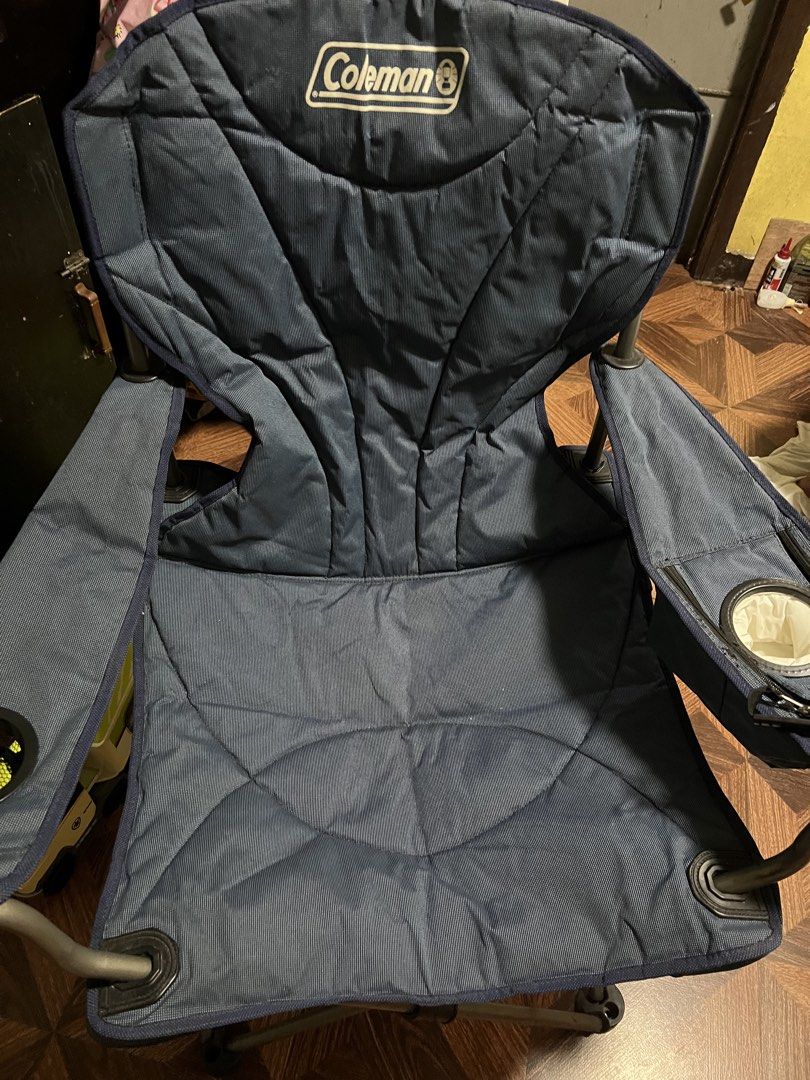Coleman Camping Chair with Cup Holder (Category: Hiking & Camping) located in Quezon City. Submitted by daday39 (Listing ID 1455264267, Image 2). Description: - King Size -Navy blue Coleman camping chair - Built-in cup holder on armrest - Folds easily for storage and transport - Sturdy metal frame - Fabric is clean and intact - Ideal for camping, picnics, sporting events, and other outdoor activities Note no carrying bag Need wash .