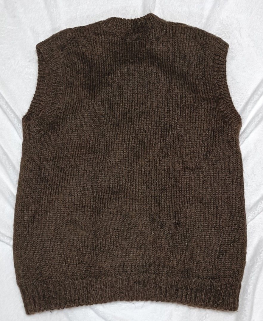 Confidence Brown Cable Knit Button-Up Vest (Category: Vests) located in Cabanatuan. Submitted by juantamadthirftshop (Listing ID 1455260591, Image 3). Description: - Brand: Confidence - Style: Brown cable knit vest - Features: Quilted lining, button-up front, two front pockets - Ideal for: Layering in cooler weather - Measurements: Pit to pit approx 22 inches, length approx 28 inches.