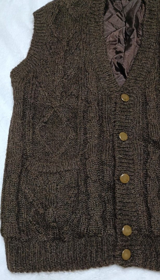 Confidence Brown Cable Knit Button-Up Vest (Category: Vests) located in Cabanatuan. Submitted by juantamadthirftshop (Listing ID 1455260591, Image 2). Description: - Brand: Confidence - Style: Brown cable knit vest - Features: Quilted lining, button-up front, two front pockets - Ideal for: Layering in cooler weather - Measurements: Pit to pit approx 22 inches, length approx 28 inches.