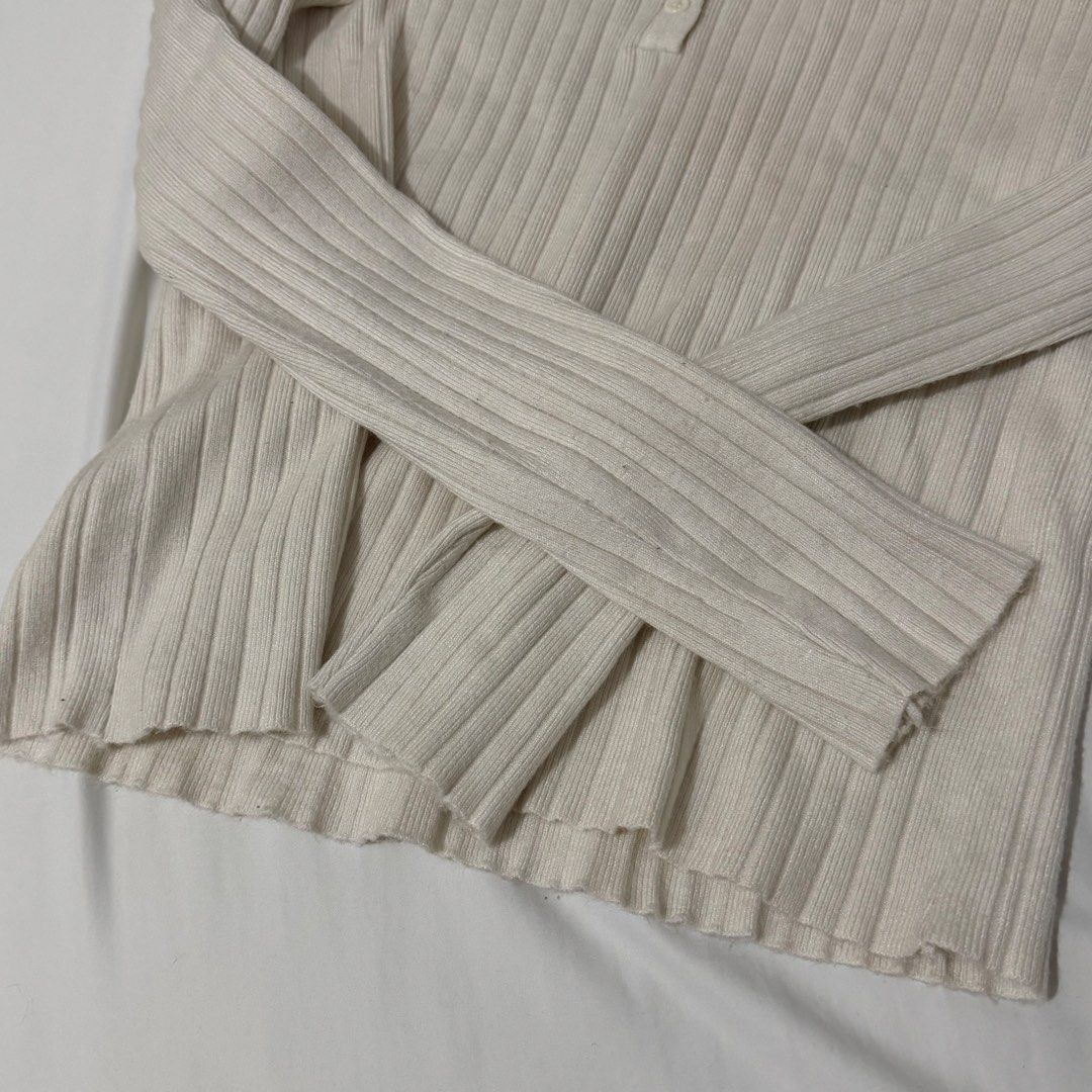 Cream Ribbed Henley Long Sleeve Top (Category: Longsleeves) located in Kawit. Submitted by grazielaa (Listing ID 1455252647, Image 3). Description: - Cream ribbed long sleeve top - Henley neckline with buttons - Stretchy and comfortable fabric - Fits true to size - Versatile: great for layering or wearing on its own - Easy to style with jeans or skirts RFS: decluttering .