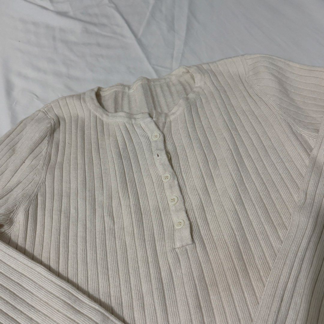 Cream Ribbed Henley Long Sleeve Top (Category: Longsleeves) located in Kawit. Submitted by grazielaa (Listing ID 1455252647, Image 2). Description: - Cream ribbed long sleeve top - Henley neckline with buttons - Stretchy and comfortable fabric - Fits true to size - Versatile: great for layering or wearing on its own - Easy to style with jeans or skirts RFS: decluttering .