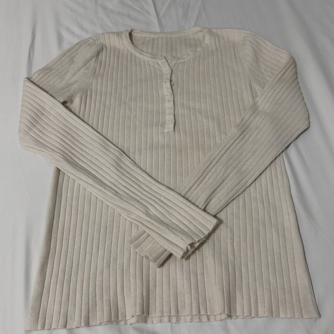 Cream Ribbed Henley Long Sleeve Top (Category: Longsleeves) located in Kawit. Submitted by grazielaa (Listing ID 1455252647, Image 1). Description: - Cream ribbed long sleeve top - Henley neckline with buttons - Stretchy and comfortable fabric - Fits true to size - Versatile: great for layering or wearing on its own - Easy to style with jeans or skirts RFS: decluttering .