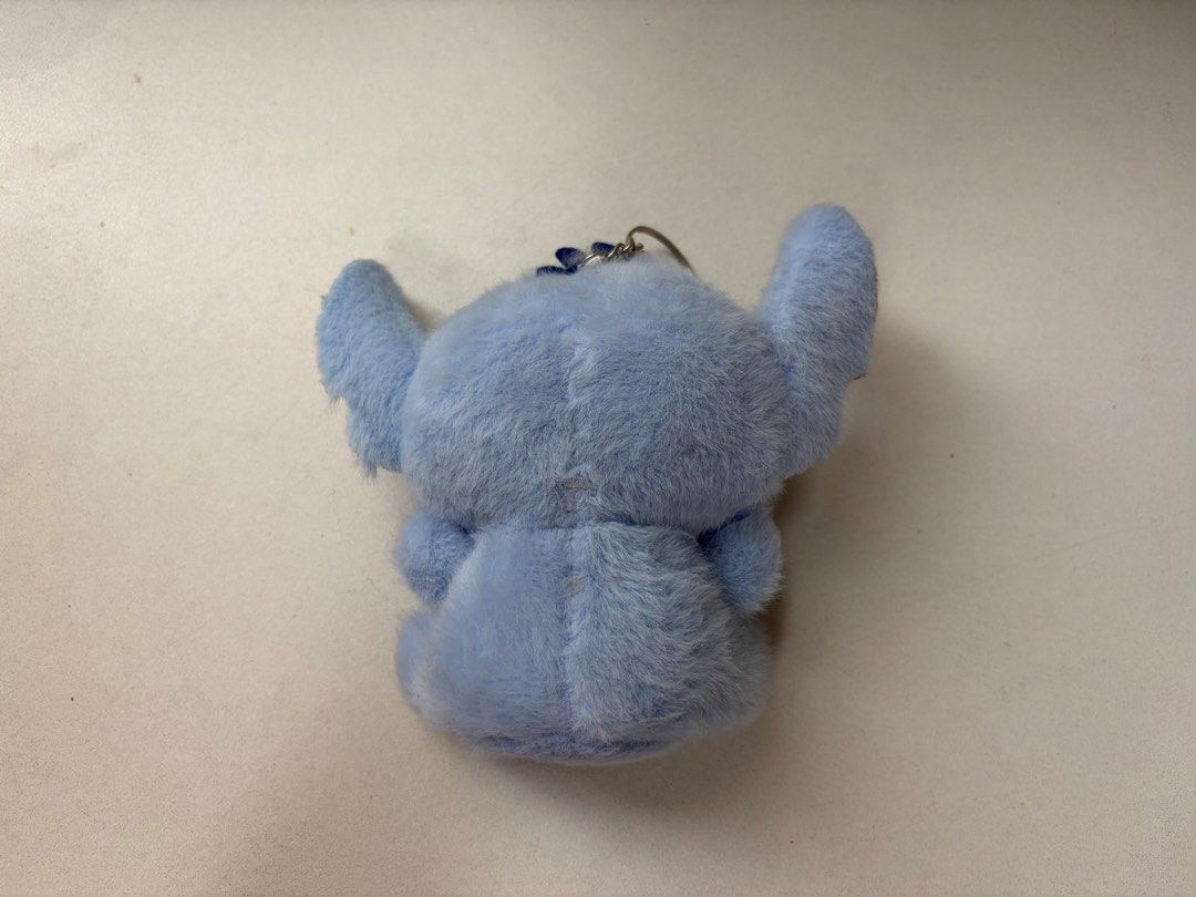 Cute Blue Stitch Cat Plush Keychain (Category: Plushies & Soft Toys) located in Manila. Submitted by na.serr (Listing ID 1455197976, Image 3). Description: - Adorable blue plush keychain - Features Stitch-like design with cute cat ears and face - Comes with a sturdy metal keyring - Ideal for decorating bags, backpacks, or as a cute accessory - Made from soft and fluffy material - A must-have for fans of cute characters!.