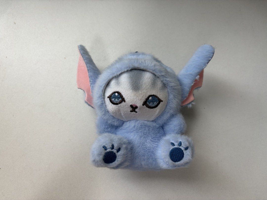 Cute Blue Stitch Cat Plush Keychain (Category: Plushies & Soft Toys) located in Manila. Submitted by na.serr (Listing ID 1455197976, Image 2). Description: - Adorable blue plush keychain - Features Stitch-like design with cute cat ears and face - Comes with a sturdy metal keyring - Ideal for decorating bags, backpacks, or as a cute accessory - Made from soft and fluffy material - A must-have for fans of cute characters!.