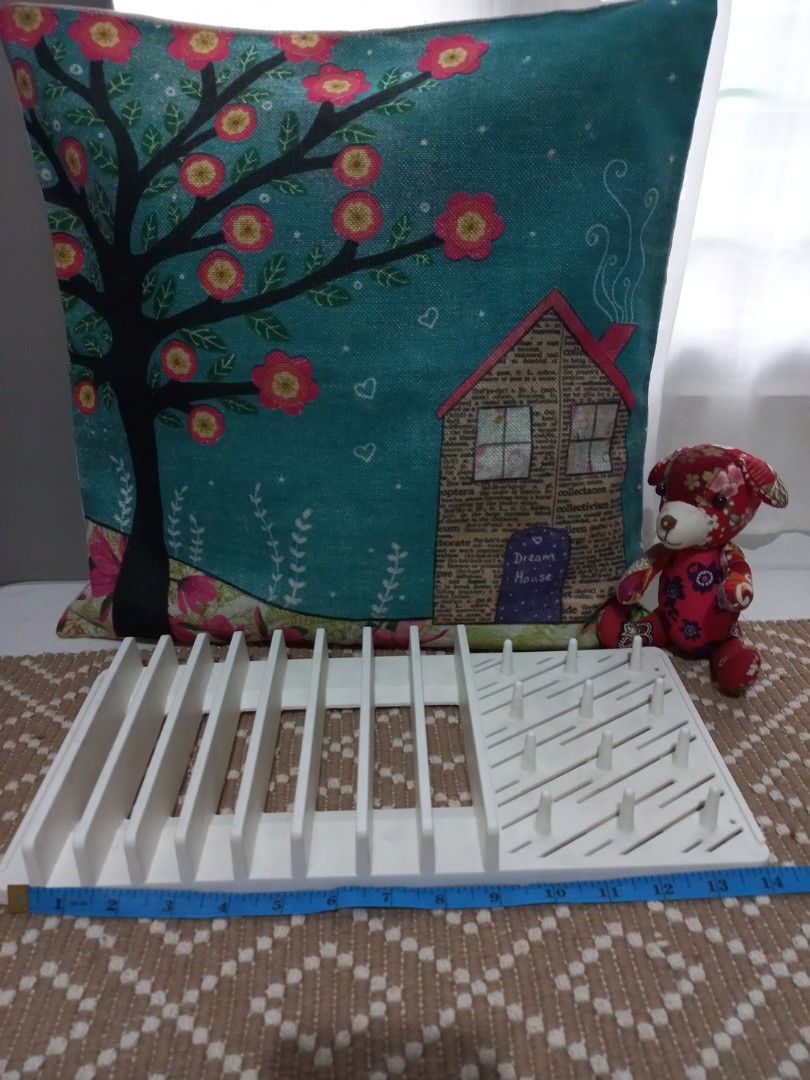 Daiso White Drying Tray Rack for Bottles & Utensils (Category: Breastfeeding & Bottle Feeding) located in Naga. Submitted by greatchance (Listing ID 1455202754, Image 1). Description: - Daiso White Drying Rack - Ideal for baby bottles, straws, and small kitchen utensils - Features multiple pegs and slots for efficient drying - Compact design, measures approx. 37cm x 16.5cm - Brand new and unused.