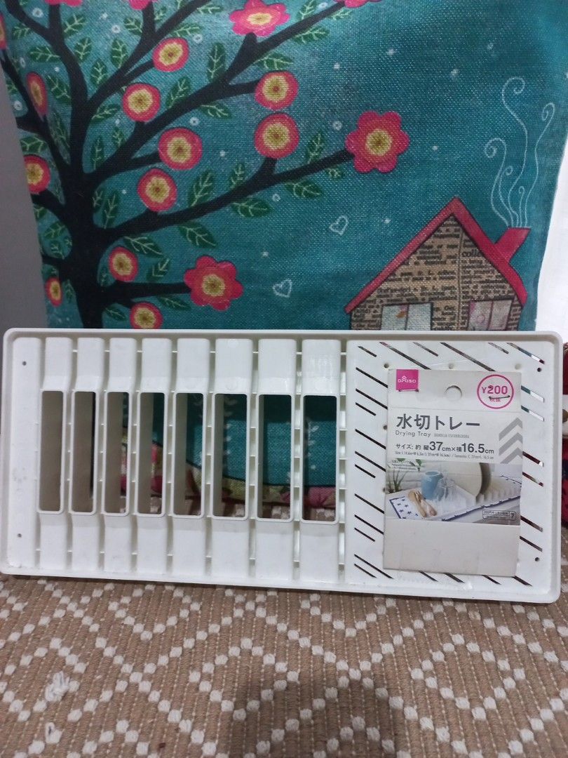 Daiso White Drying Tray Rack for Bottles & Utensils (Category: Breastfeeding & Bottle Feeding) located in Naga. Submitted by greatchance (Listing ID 1455202754, Image 2). Description: - Daiso White Drying Rack - Ideal for baby bottles, straws, and small kitchen utensils - Features multiple pegs and slots for efficient drying - Compact design, measures approx. 37cm x 16.5cm - Brand new and unused.