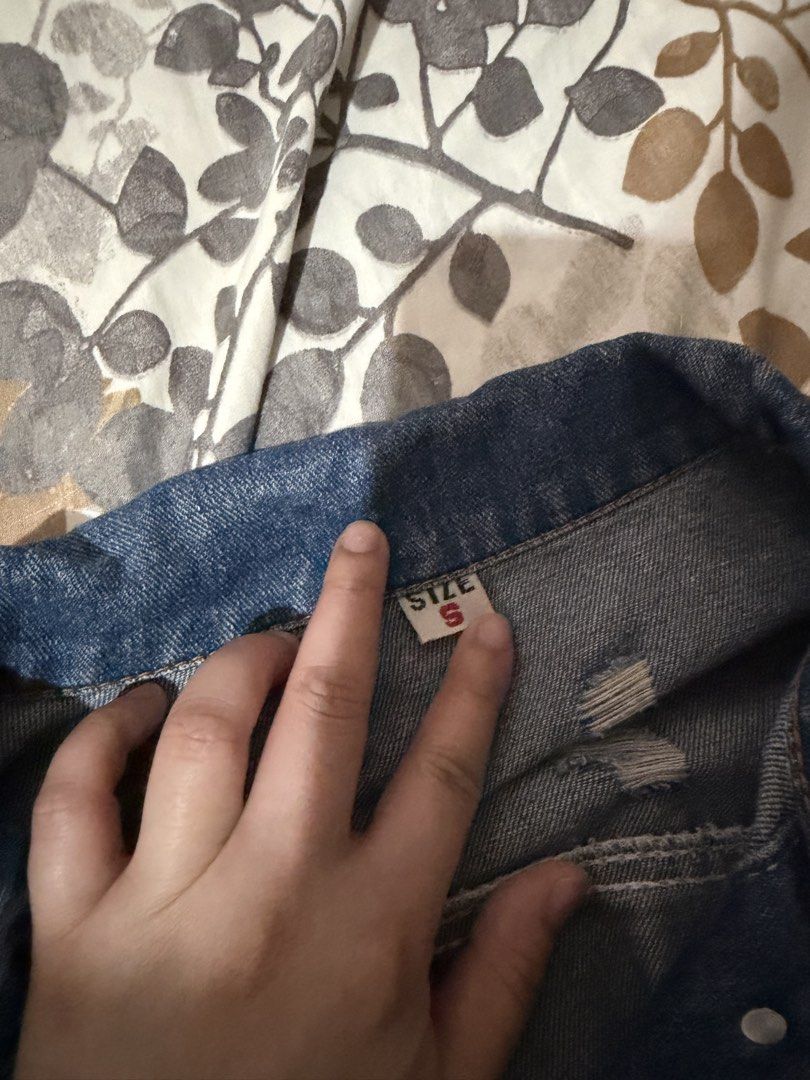 Distressed Blue Denim Jacket Size S (Category: Coats, Jackets and Outerwear) located in Taytay. Submitted by cloudy_20 (Listing ID 1455272596, Image 3). Description: - Cool distressed blue denim jacket - Ripped details on sleeves and back - Button-up front with pockets - Size S up to M.