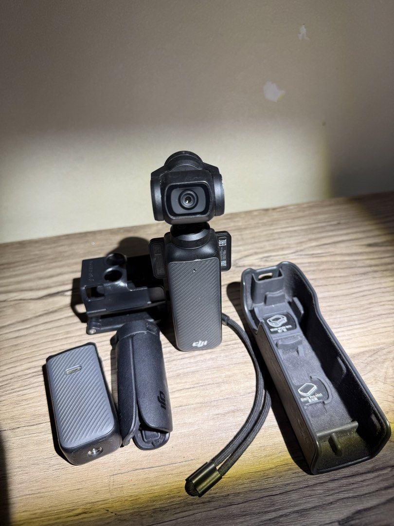 Dji Osmo Pocket 3 (Category: Video Cameras) located in Manila. Submitted by jaredl11 (Listing ID 1455222506, Image 2). Description: Bought January 2026 - RFS: Getting Pocket 4 Dji Osmo Pocket 3 - Button cover - Stand - battery Extensions - Camera Cover.