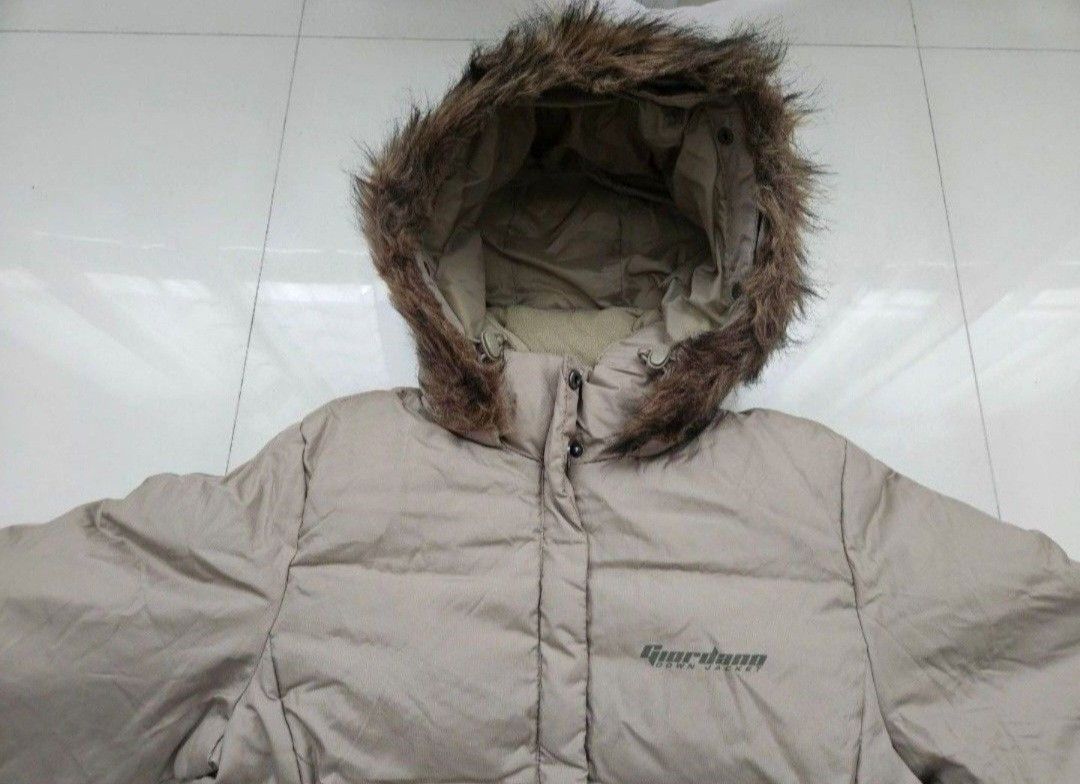 Down Jacket (Category: Coats, Jackets and Outerwear) located in Singapore. Submitted by ginger.flower (Listing ID 1455273186, Image 2). Description: - Brand: Giordana - Type: Down Puffer Jacket - Colour: Beige - Size: M (UK 10 / US 6) - Keeps you warm n stylish - Features: Detachable faux fur trimmed hood, layered design for warmth and protection - Condition: Great - Style: Suitable for winter wear and sub zero weather outdoor activities -Ptp: 50