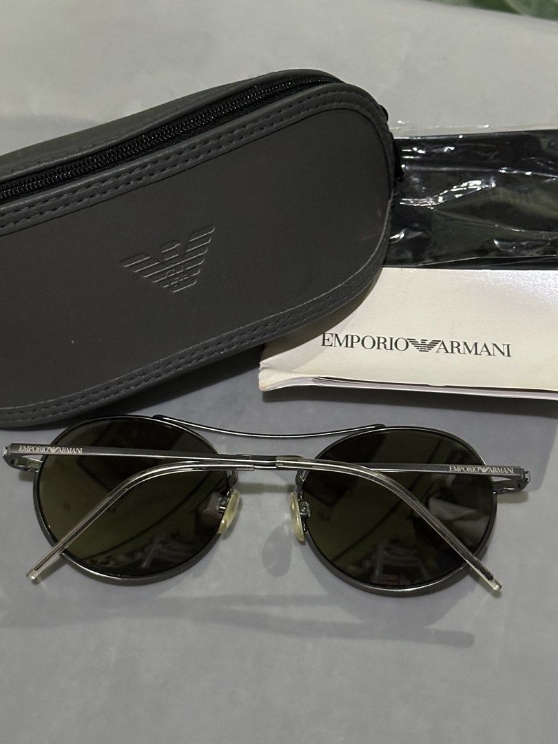 Emporio Armani Round Sunglasses with Case (Category: Sunglasses & Eyewear) located in Rodriguez. Submitted by mnl_premium_essentials (Listing ID 1455207264, Image 2). Description: Authentic Emporio Armani sunglasses - Stylish round metal frames - Tinted lenses for sun protection - Emporio Armani logo visible on arms and lenses - Includes original hard case and cleaning cloth - Ideal for sunny weather Original .