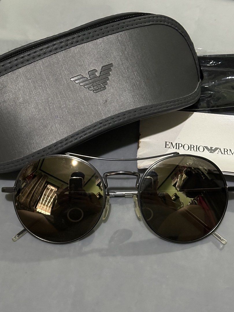 Emporio Armani Round Sunglasses with Case (Category: Sunglasses & Eyewear) located in Rodriguez. Submitted by mnl_premium_essentials (Listing ID 1455207264, Image 1). Description: Authentic Emporio Armani sunglasses - Stylish round metal frames - Tinted lenses for sun protection - Emporio Armani logo visible on arms and lenses - Includes original hard case and cleaning cloth - Ideal for sunny weather Original .