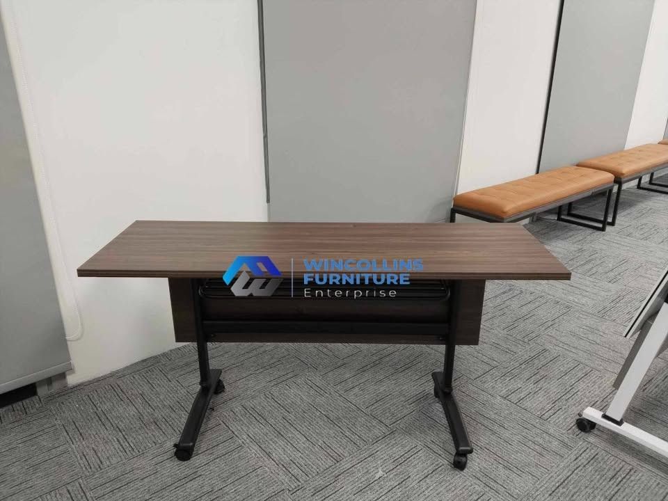 Folding Training Table / Study Desk Table / Office Table (Category: Tables & Sets) located in Caloocan City. Submitted by mayanncamu.furniture (Listing ID 1455148685, Image 2). Description: Office Folding Training Table / Study Table Melamine scratch proof table top and modesty With 2nd layer shelf Black Tubular legs with caster wheels Color: Beech.