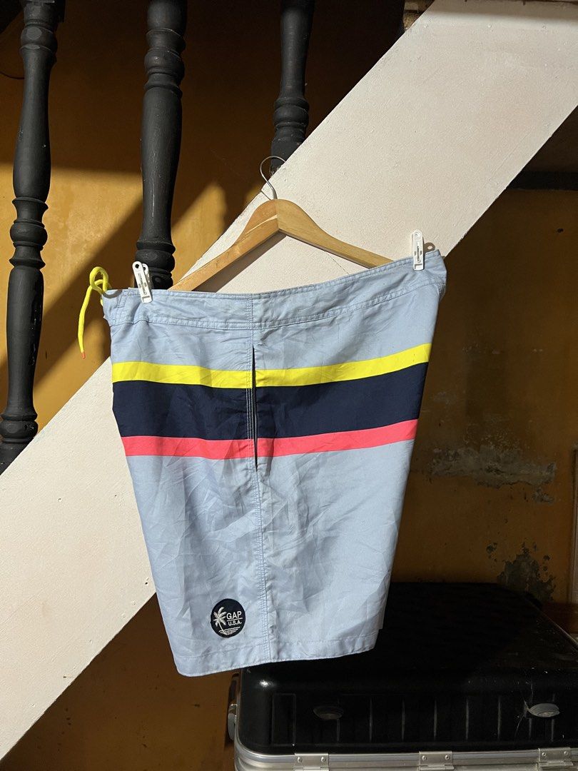 Gap Men's Striped Board Shorts XL (Category: Shorts) located in Butuan. Submitted by nikthrift. (Listing ID 1455254509, Image 2). Description: - Brand: Gap - Size: XL - Color: Light blue with colorful stripes - Features: Cargo pocket on right leg, drawstring waist for adjustable fit - Material: 100% Polyester - Ideal for: Swimming, beach, or casual wear - 36-38 waistline - 19 length.
