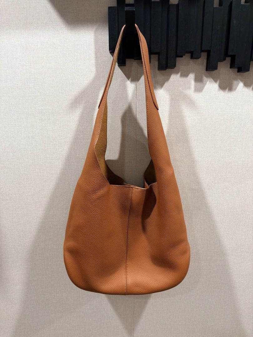 Genuine Leather Tote Bag, Pebbled Tan (Category: Tote Bags) located in Pasig City. Submitted by theclosetcasemanila (Listing ID 1455295208, Image 1). Description: Genuine leather Pebbled texture Lightweight Super easy to carry. Perfect size for everyday. Approx w14” x h10.5” xD5” Handle Drop 14” Magnetic closure Excellent condition. No flaws .
