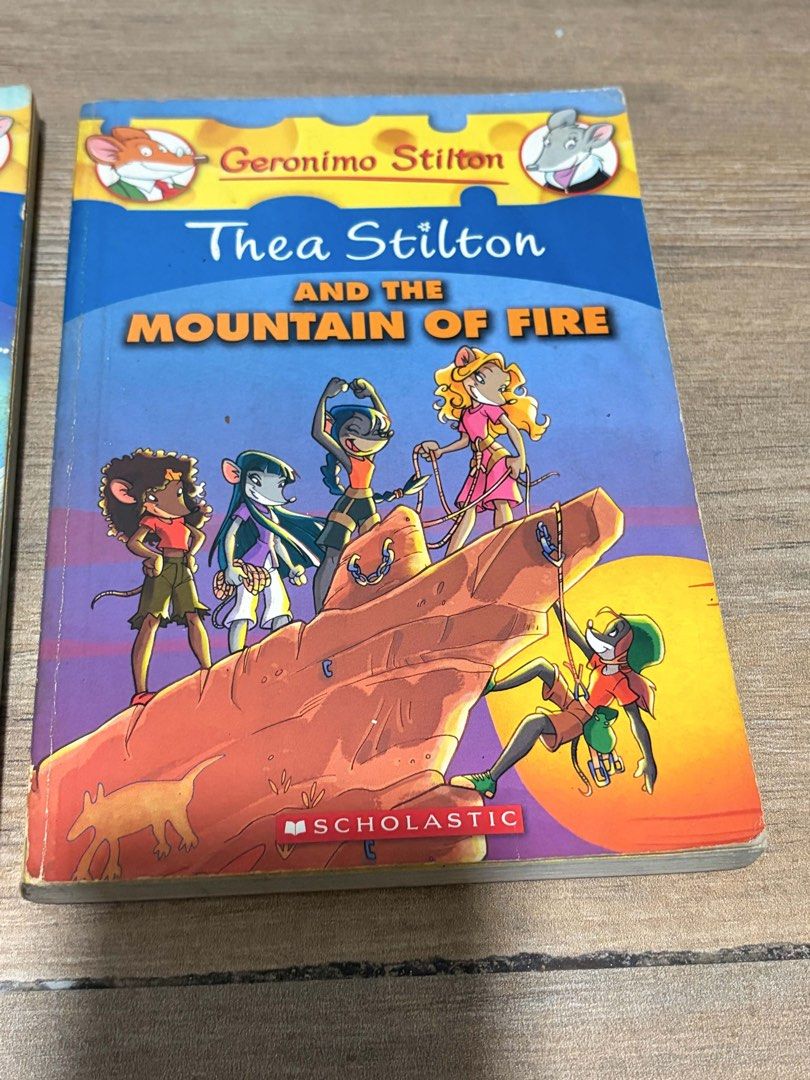 Geronimo Stilton & Thea Stilton Books (3 Books) (Category: Children's Books) located in Pasig City. Submitted by heyikate (Listing ID 1455269754, Image 2). Description: - Set of 3 Geronimo Stilton and Thea Stilton books. - Includes: 'The Discovery of America' (graphic novel), 'Thea Stilton and the Ice Treasure', and 'Thea Stilton and the Mountain of Fire'. - Perfect for young readers who enjoy adventure stories. - All books are full-color illustr