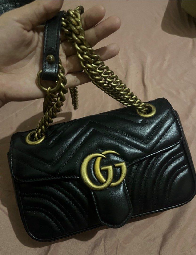 Gucci GG Marmont Small Shoulder Bag (Category: Luxury Bags & Wallets) located in Manila. Submitted by manifestd (Listing ID 1397802530, Image 2). Description: Gucci GG Marmont Shoulder/ Crossbody Bag Mini - Black chevron design, quilted - Gold-tone chain strap and GG logo -Chain strap and can be worn as a shoulder bag or a crossbody bag. -Excellent condition.no issue -Lalamove ready .