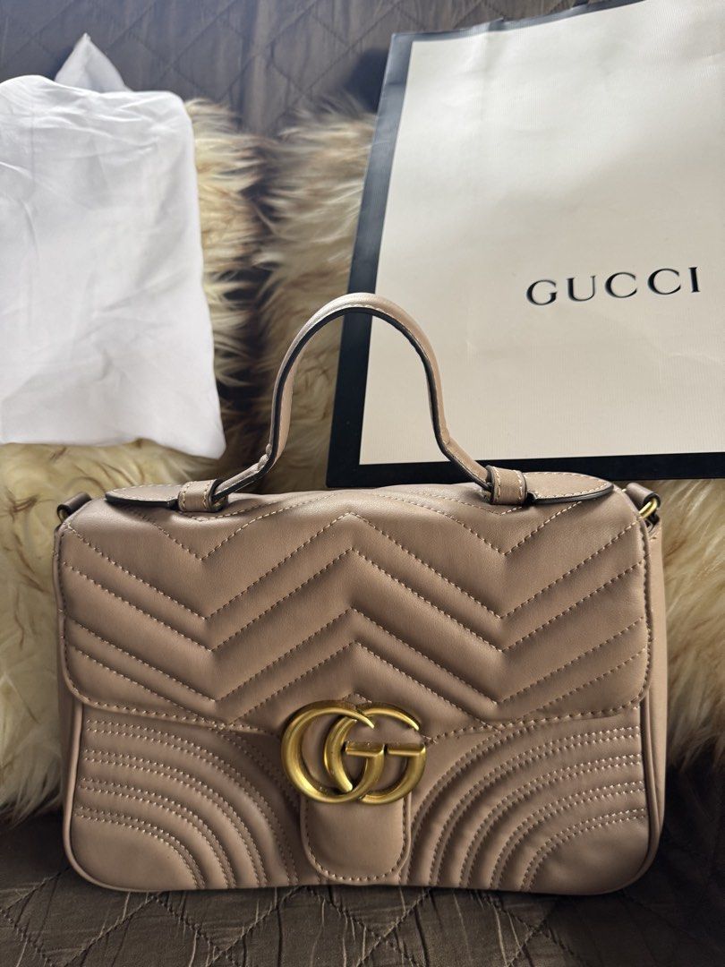 Gucci Marmont Matelassé Shoulder Bag (Category: Luxury Bags & Wallets) located in Tagaytay City. Submitted by itsrej (Listing ID 1455172603, Image 1). Description: - Authentic Gucci GG Marmont Bag - Color: Beige/Nude - Material: Quilted Leather with Chevron Pattern - Hardware: Gold-tone - Interior: Zip Pocket - Includes: Dust Bag and Shopping Bag - Versatile: Ideal for everyday or special occasions.