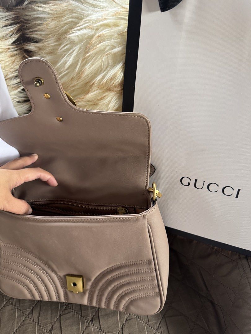 Gucci Marmont Matelassé Shoulder Bag (Category: Luxury Bags & Wallets) located in Tagaytay City. Submitted by itsrej (Listing ID 1455172603, Image 2). Description: - Authentic Gucci GG Marmont Bag - Color: Beige/Nude - Material: Quilted Leather with Chevron Pattern - Hardware: Gold-tone - Interior: Zip Pocket - Includes: Dust Bag and Shopping Bag - Versatile: Ideal for everyday or special occasions.