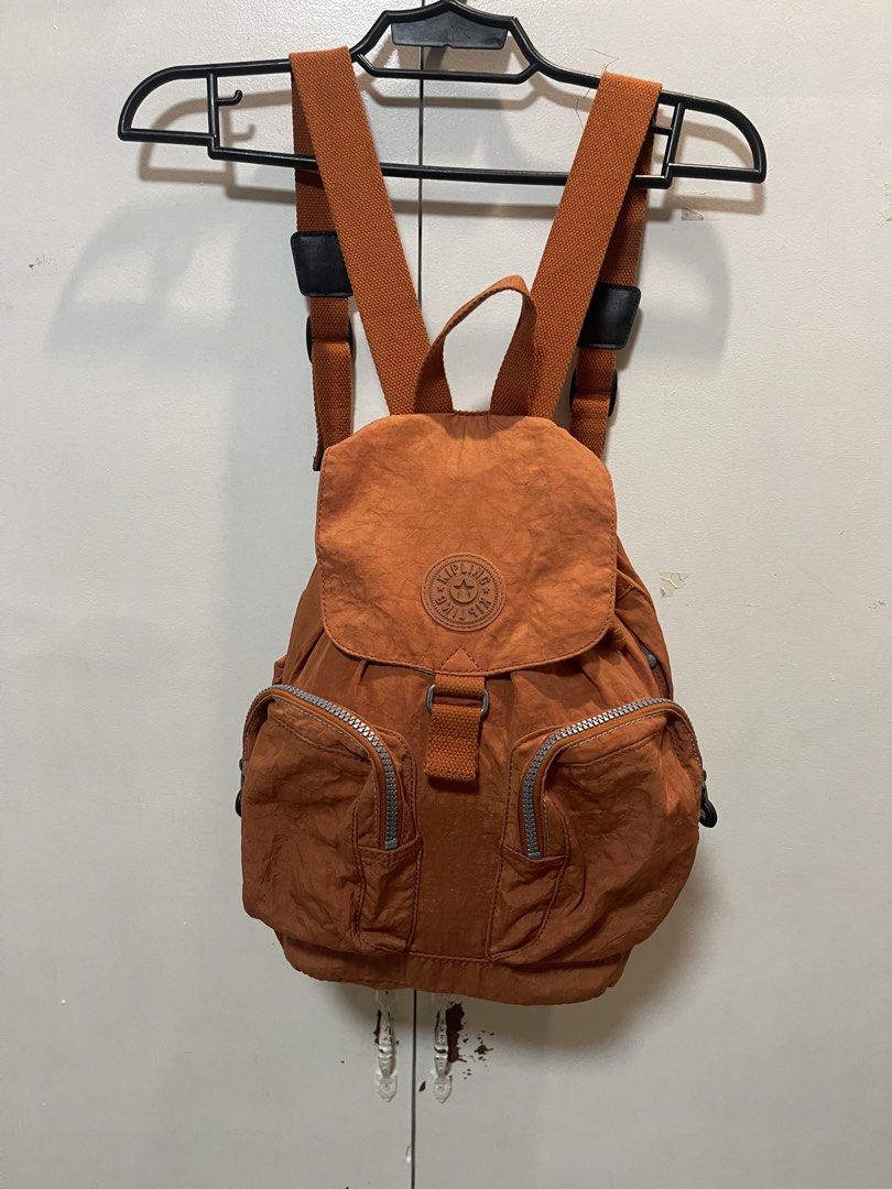 Kipling Orange Nylon Backpack (Category: Backpacks) located in Davao. Submitted by rcgulanes.moon (Listing ID 1455161055, Image 3). Description: - Orange Kipling backpack - Made of durable crinkled nylon - Secure drawstring closure under flap - Two convenient front zip pockets - Adjustable shoulder straps for comfort - Ideal for everyday adventures.