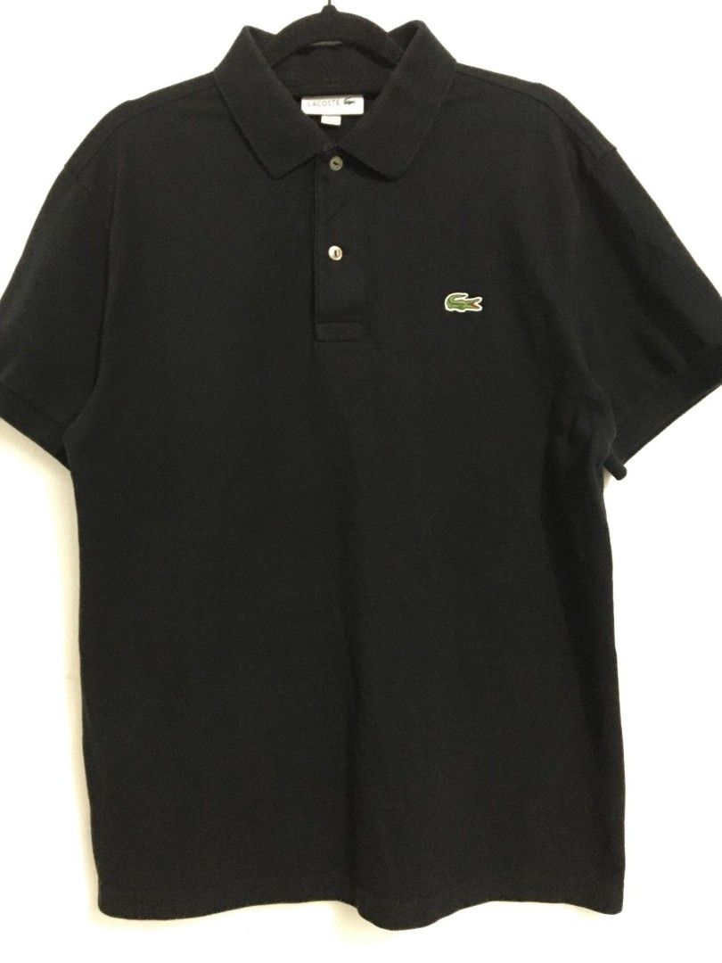 Lacoste Black Polo Shirt - Size M (Category: Tshirts & Polo Shirts ) located in Toledo. Submitted by mrb.thrift (Listing ID 1455296645, Image 2). Description: - Classic black Lacoste polo shirt - Features iconic crocodile logo on chest - Made from 100% cotton - Size: FR 4 (fits US Medium) - Versatile for casual or smart-casual wear DIMES:20-22*27 ASNEW CONDITION .