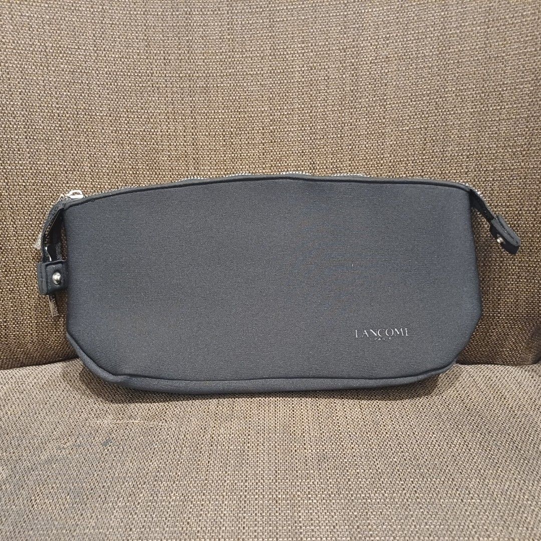 Lancome Paris Cosmetic Bag (Category: Makeup) located in Manila. Submitted by manalastas12411 (Listing ID 1455250665, Image 1). Description: - Authentic Lancome Paris makeup pouch - Stylish dark grey material with embossed logo - Secure zipper closure with branded pull tabs - Perfect size for travel or everyday essentials - Clean and well-maintained, inside and out - Ideal for organizing your makeup collection.