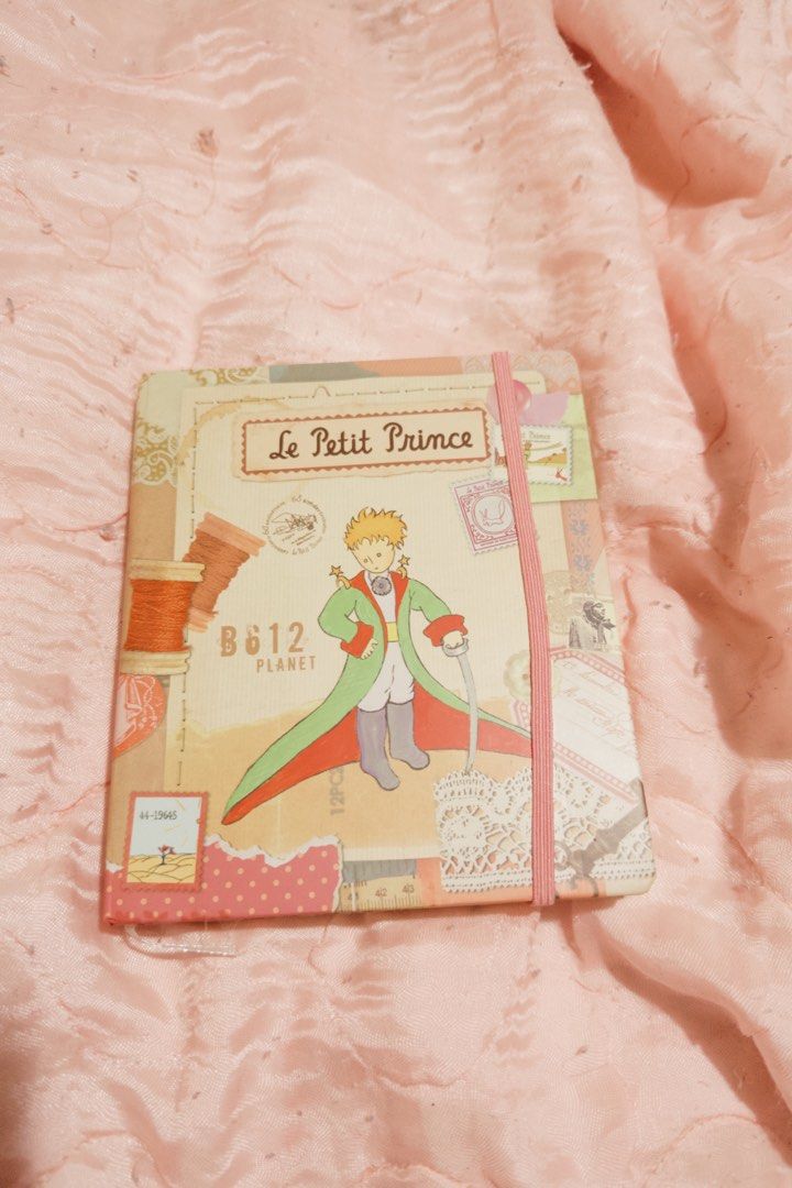 Le Petit Prince Hardbound Journal Notebook (Category: Stationery & School Supplies) located in Manila. Submitted by ashleylazarte (Listing ID 1455216767, Image 3). Description: Hi for those interested just message me, you can haggle especially if you buy more ^^ Condition: Brand New Details: - Lined pages with Bible verses. - Features an elastic closure. - No pages have been written on. - Stored properly and kept in good condition. Please review 