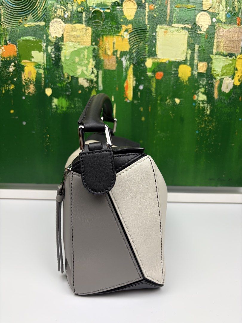 Loewe x Albers Puzzle Bag (Category: Luxury Bags & Wallets) located in Mabalacat. Submitted by to_ph (Listing ID 1455298843, Image 3). Description: ✨AVAILABLE✨ LOEWE SMALL PUZZLE BAG Best Price ₱150000 Condition: Excellent 9/10 Description: LoewexJosef Albers collaboration(limited edition)calf leather/suede lining/ black,grey,light ghost color Hardware: Silver Hardware Inclusions: dust bag, detachable leather strap,receipt Date Purchased: 2025 (D