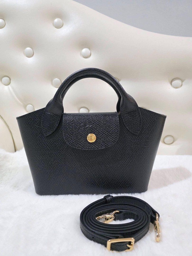 Longchamp epure XS (Category: Luxury Bags & Wallets) located in Caloocan City. Submitted by snowcloudd (Listing ID 1455297258, Image 3). Description: - Classic Longchamp design - Made from quality leather - Top handle with detachable shoulder strap - Available in multiple colors - Ideal for daily use or special occasions - Spacious interior for essentials.