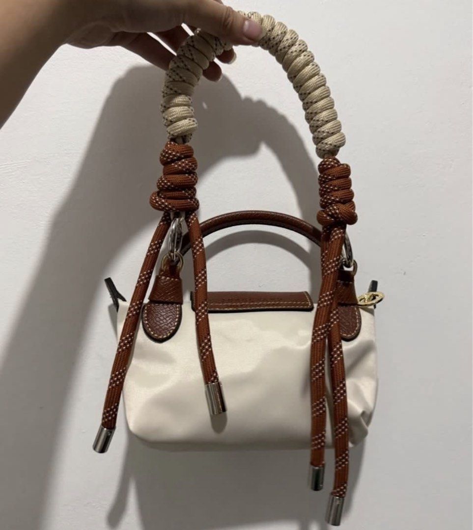 Longchamp Mini Le Pliage Cuir Top Handle Bag (Category: Luxury Bags & Wallets) located in Muntinlupa City. Submitted by and3333 (Listing ID 1455192946, Image 2). Description: 2 straps included! Authentic (got it from japan) Can provide more photos, dm! .