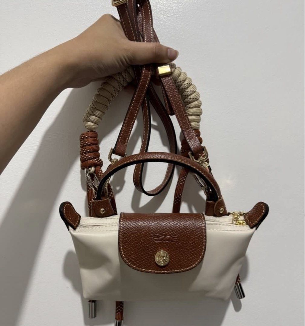 Longchamp Mini Le Pliage Cuir Top Handle Bag (Category: Luxury Bags & Wallets) located in Muntinlupa City. Submitted by and3333 (Listing ID 1455192946, Image 3). Description: 2 straps included! Authentic (got it from japan) Can provide more photos, dm! .