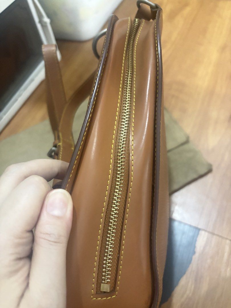 Louis Vuitton Epi Leather Backpack Tan (Category: Luxury Bags & Wallets) located in Manila. Submitted by khring (Listing ID 1455242804, Image 3). Description: - Brown Louis Vuitton backpack - Epi leather material - Gold tone hardware with LV logo zipper pulls - Adjustable straps - Comes with dust bag - Great for everyday use.