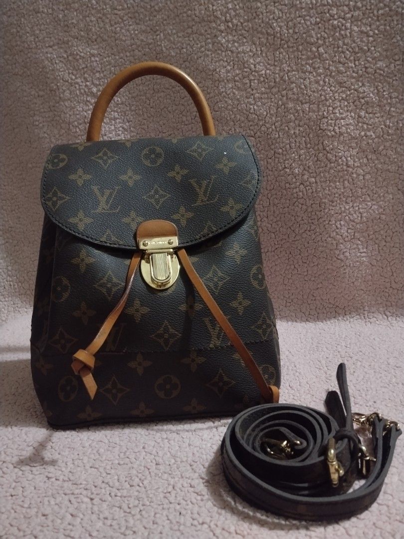 Louis Vuitton Monogram Canvas Backpack (Category: Luxury Bags & Wallets) located in Manila. Submitted by ineeeglp (Listing ID 1455230690, Image 1). Description: - Classic Louis Vuitton monogram backpack - Iconic LV print with elegant leather trim - Features a convenient top handle - Secure drawstring closure with a stylish twist lock - Includes a detachable shoulder strap for versatile carrying - Ideal for everyday adventures or travel escapades.