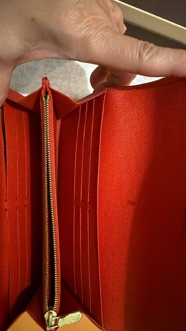 Louis Vuitton Monogram Envelope Wallet (Category: Luxury Bags & Wallets) located in Manila. Submitted by rissa1269 (Listing ID 1455199565, Image 2). Description: - Classic Louis Vuitton monogram wallet - Envelope style with snap closure - Vibrant red interior - Multiple card slots - Zippered coin pocket - Gold-tone hardware with LV logo zipper pull - Perfect for everyday use note:button snap is a little lose.