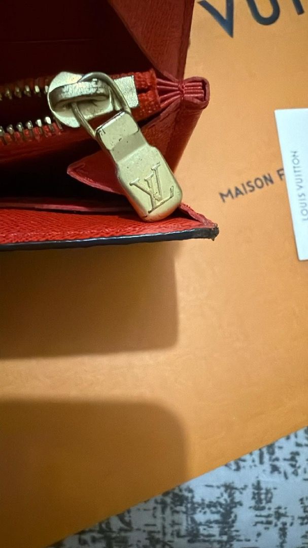 Louis Vuitton Monogram Envelope Wallet (Category: Luxury Bags & Wallets) located in Manila. Submitted by rissa1269 (Listing ID 1455199565, Image 3). Description: - Classic Louis Vuitton monogram wallet - Envelope style with snap closure - Vibrant red interior - Multiple card slots - Zippered coin pocket - Gold-tone hardware with LV logo zipper pull - Perfect for everyday use note:button snap is a little lose.