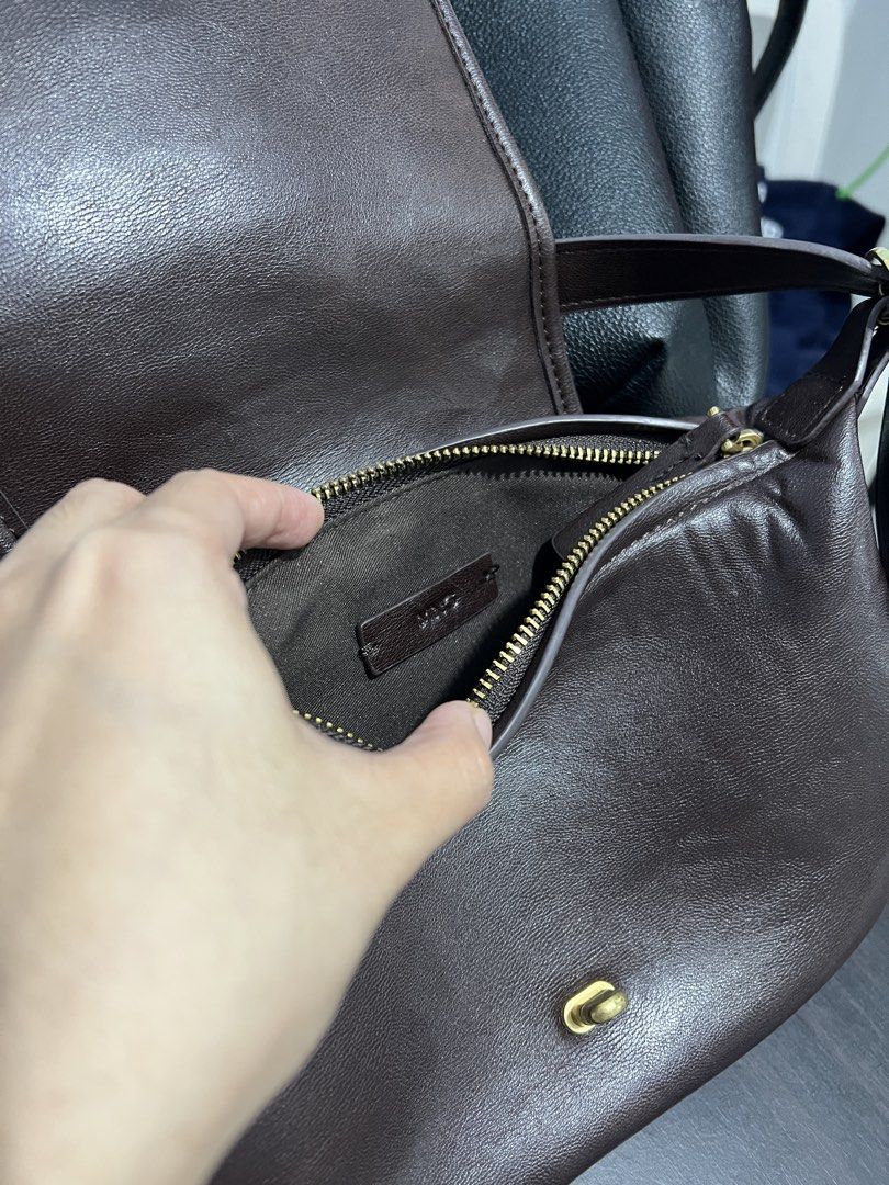 Mango - Brown shoulder bag (Category: Shoulder Bags) located in Quezon City. Submitted by ktmrn (Listing ID 1455307628, Image 3). Description: - Stylish dark brown shoulder bag - Secure front turn-lock closure - Main zippered compartment for essentials - Convenient small side pockets Bought for 2200 Excellent condition.