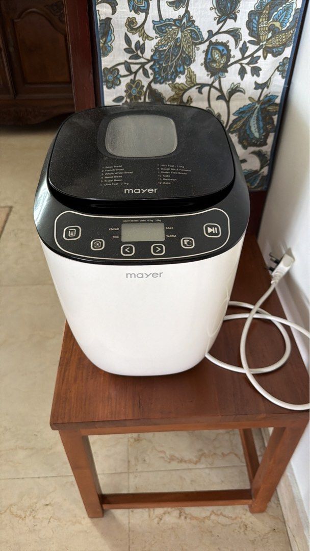 Mayer Bread Maker (Category: Breadmakers) located in Singapore. Submitted by mona_pankhart (Listing ID 1455231691, Image 1). Description: - Mayer bread maker - White and black design - Multiple settings for different bread types - Easy-to-use control panel with digital display - Includes power cord - Ideal for making delicious homemade bread.