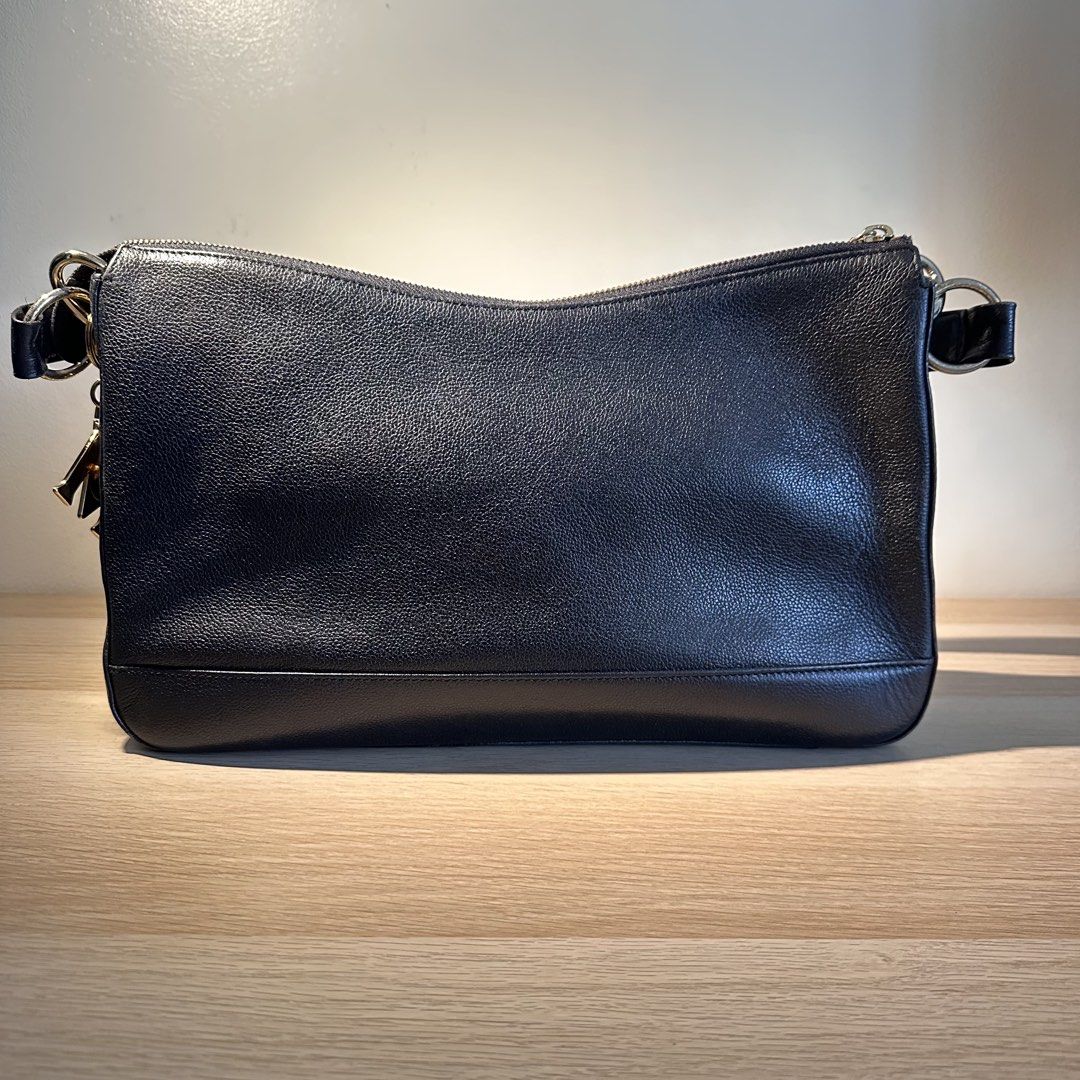MCM Black Shoulder Bag (Category: Luxury Bags & Wallets) located in Pasig City. Submitted by piposcloset (Listing ID 1455185590, Image 3). Description: MCM Black Shoulder Bag Lightly used Very presentable! ✨ 💯 Legit ₱ 3,200 + shipping Issues: Seen on pics posted.