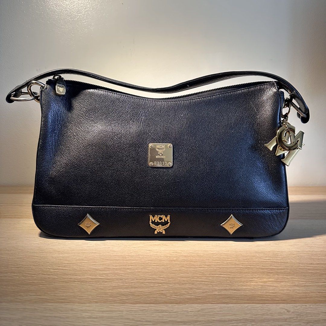 MCM Black Shoulder Bag (Category: Luxury Bags & Wallets) located in Pasig City. Submitted by piposcloset (Listing ID 1455185590, Image 2). Description: MCM Black Shoulder Bag Lightly used Very presentable! ✨ 💯 Legit ₱ 3,200 + shipping Issues: Seen on pics posted.