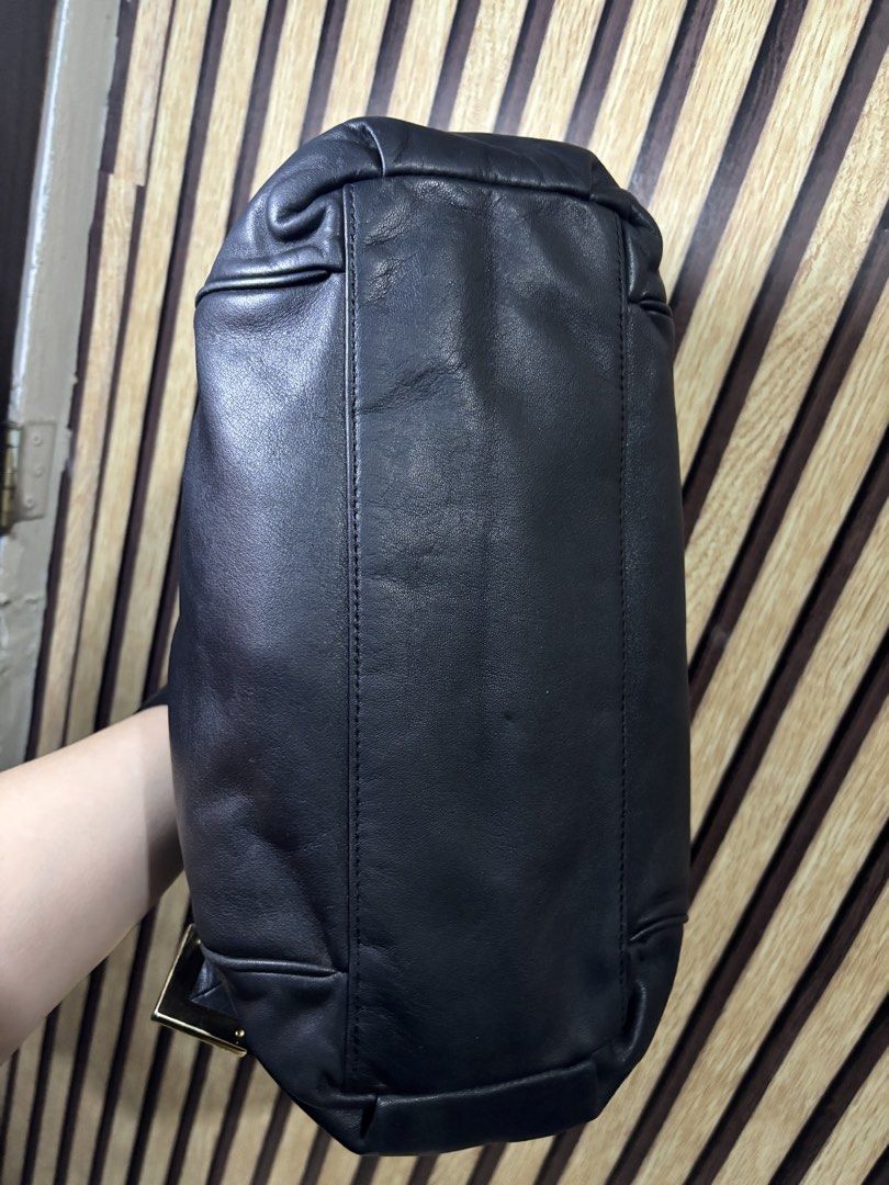 Michael Kors Black Leather Shoulder Bag Gold Hardware (Category: Luxury Bags & Wallets) located in Caloocan City. Submitted by berndale_closet (Listing ID 1455192915, Image 3). Description: - Authentic Michael Kors black leather shoulder bag - Elegant gold hardware details - Spacious main zip compartment - Convenient exterior pockets - Soft and supple leather for a luxurious feel - Adjustable straps for comfortable wear - Ideal everyday bag for a