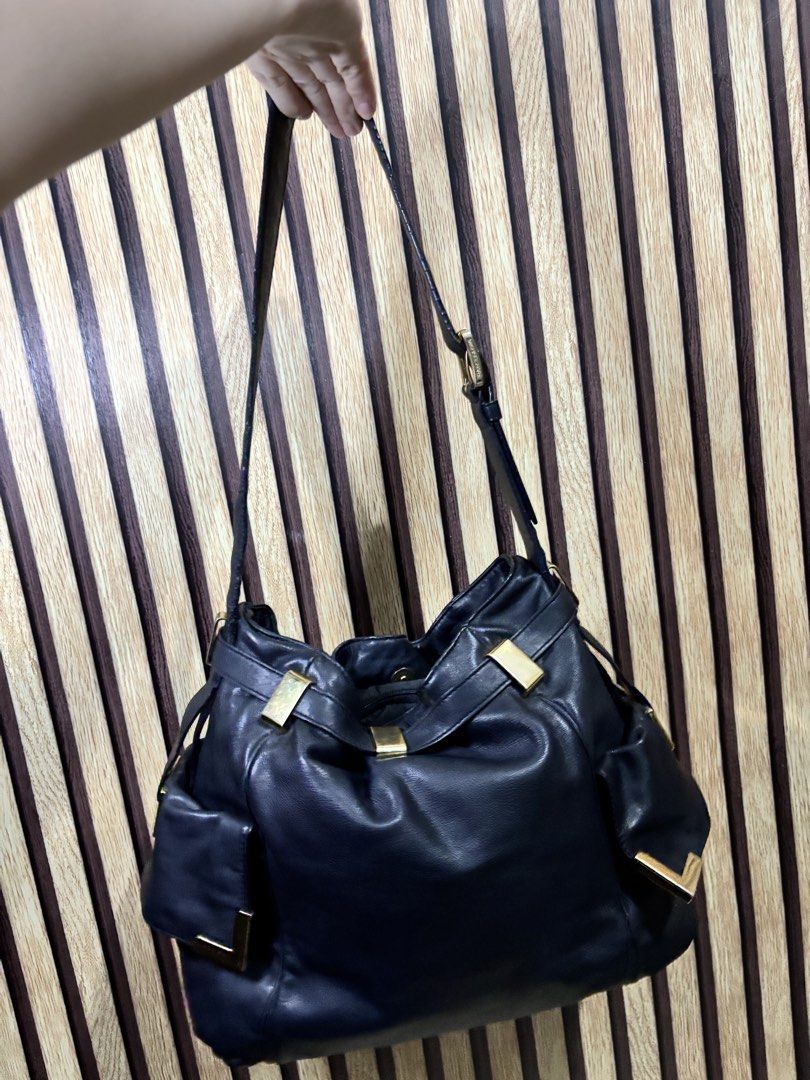 Michael Kors Black Leather Shoulder Bag Gold Hardware (Category: Luxury Bags & Wallets) located in Caloocan City. Submitted by berndale_closet (Listing ID 1455192915, Image 2). Description: - Authentic Michael Kors black leather shoulder bag - Elegant gold hardware details - Spacious main zip compartment - Convenient exterior pockets - Soft and supple leather for a luxurious feel - Adjustable straps for comfortable wear - Ideal everyday bag for a